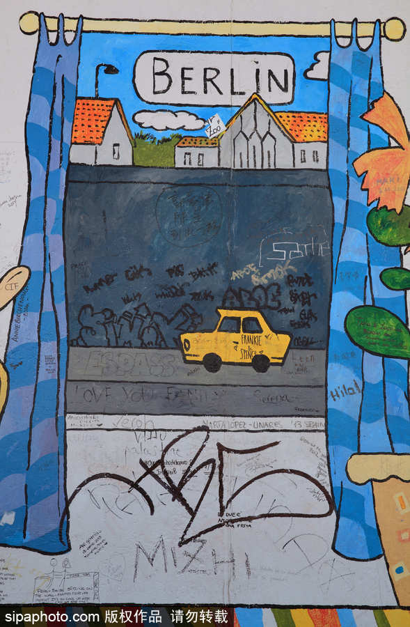 柏林墙涂鸦 黯然“铁幕之墙”变身缤纷画布