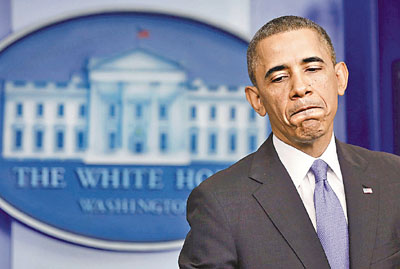 U.S. President Obama pauses while talking about the Affordable Care Act at the White House in Washington